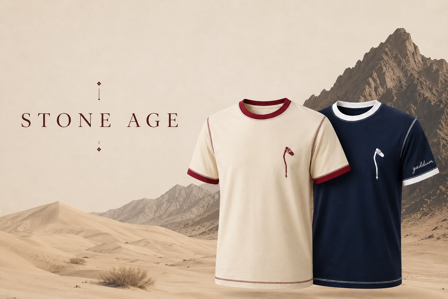 Gaddum Stone Age collection — cream and navy t-shirts against a desert landscape